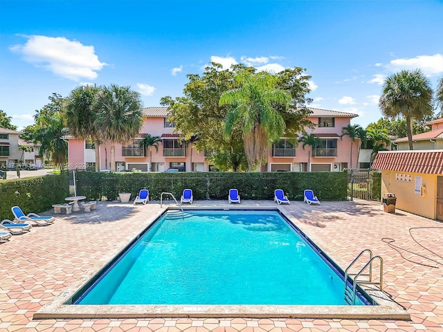 view of swimming pool with a patio area