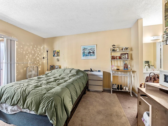 bedroom with carpet flooring and a textured ceiling