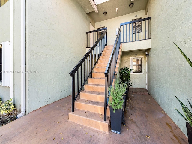 staircase with concrete floors