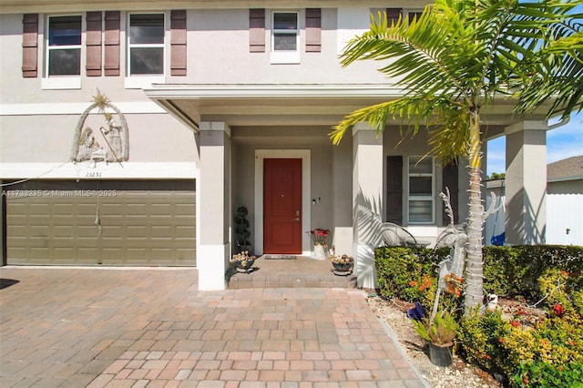 view of exterior entry featuring a garage