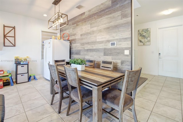 tiled dining room with wood walls