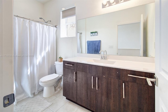 bathroom featuring tile patterned floors, toilet, curtained shower, and vanity