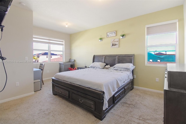 bedroom with light carpet