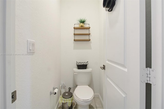 bathroom featuring tile patterned floors and toilet