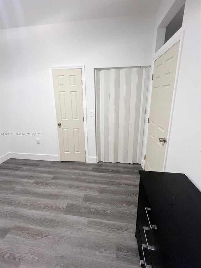 bedroom featuring hardwood / wood-style floors and a closet