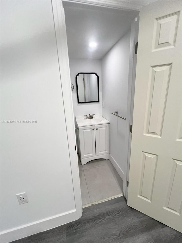 bathroom with vanity and hardwood / wood-style flooring