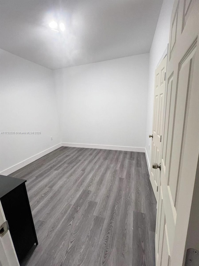 spare room featuring hardwood / wood-style flooring