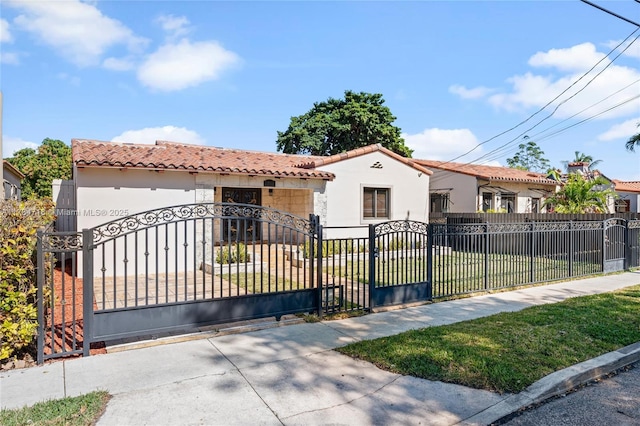 view of gate with a yard