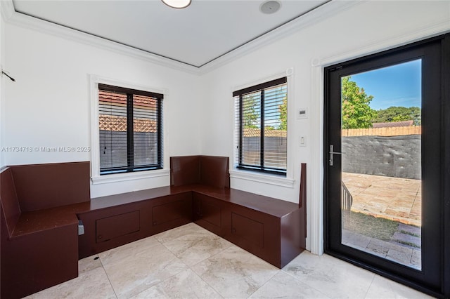 doorway featuring crown molding