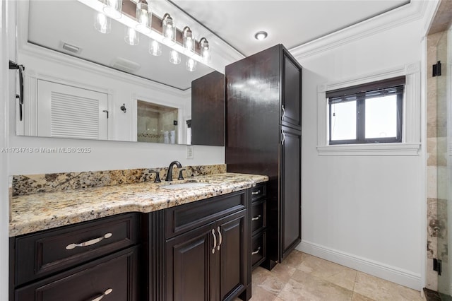 bathroom with vanity and crown molding