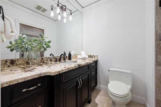 bathroom with crown molding, vanity, and toilet