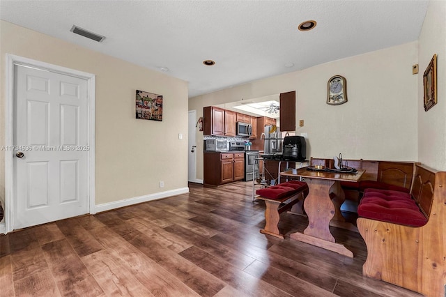 interior space featuring dark hardwood / wood-style floors and a textured ceiling