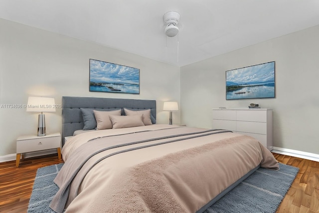 bedroom with hardwood / wood-style flooring and ceiling fan