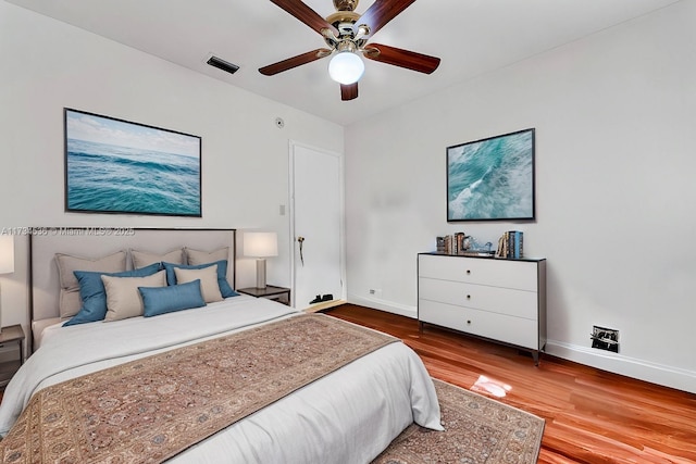 bedroom featuring wood-type flooring and ceiling fan