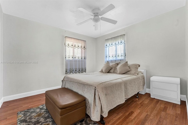 bedroom featuring ceiling fan and wood-type flooring