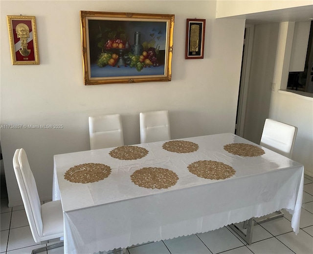 dining room featuring light tile patterned flooring