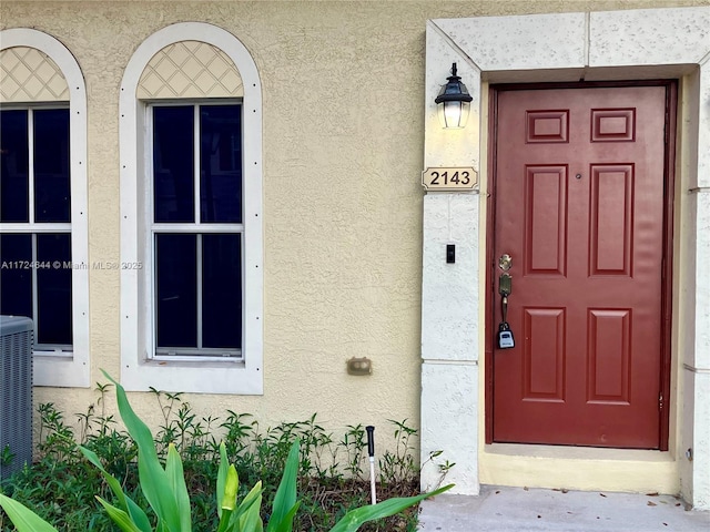 doorway to property with central air condition unit