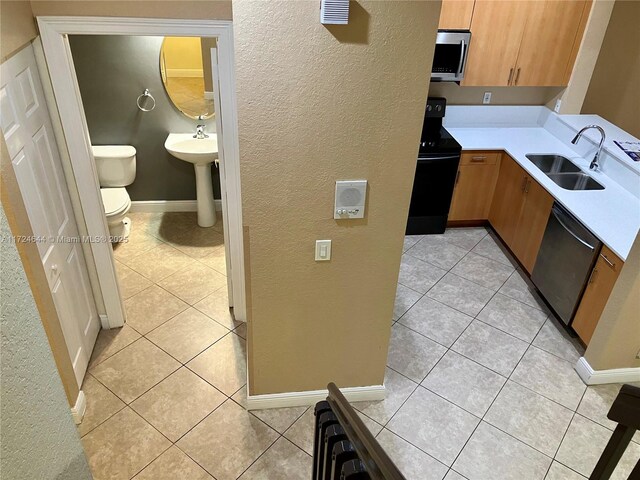 stairway featuring crown molding and tile patterned floors