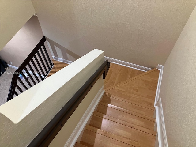 stairway with wood-type flooring