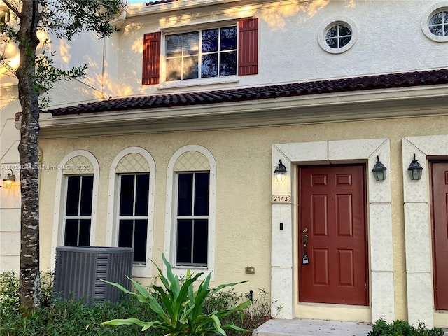 doorway to property with central air condition unit