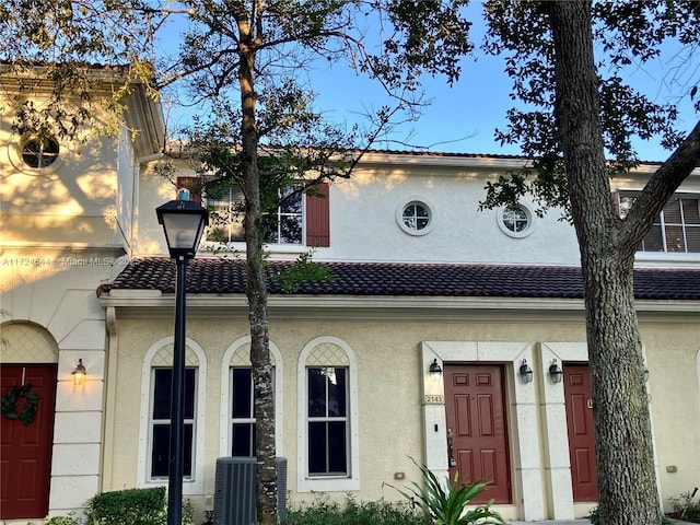 mediterranean / spanish-style house featuring central AC