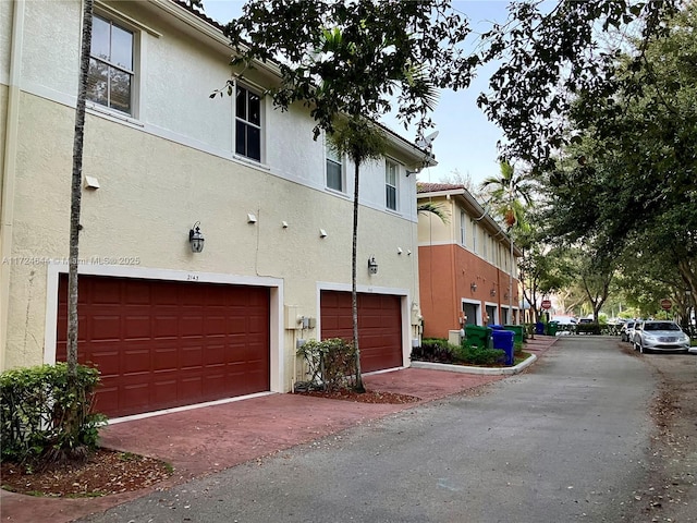 view of side of home with a garage