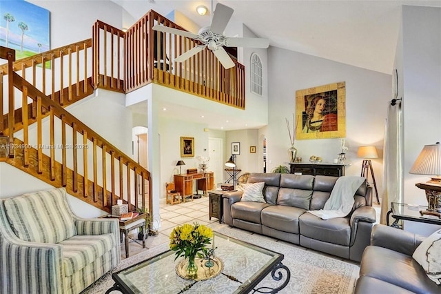 living room with high vaulted ceiling, light tile patterned floors, and ceiling fan