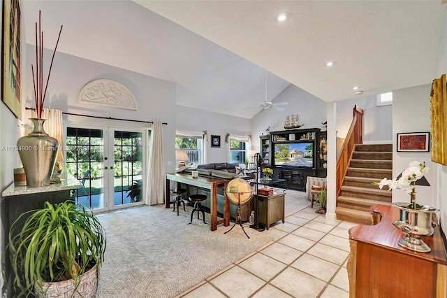 living room featuring french doors, light colored carpet, ceiling fan, and high vaulted ceiling