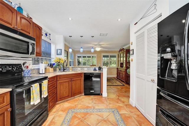 kitchen featuring sink, crown molding, light tile patterned floors, black appliances, and a textured ceiling