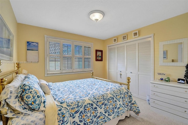 carpeted bedroom with a closet