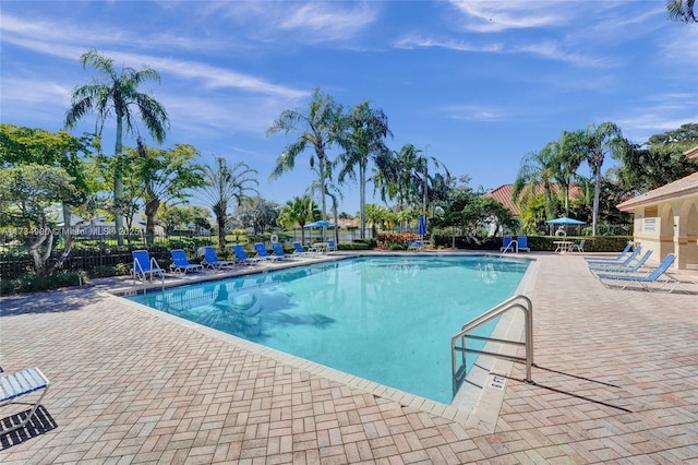 view of swimming pool with a patio area