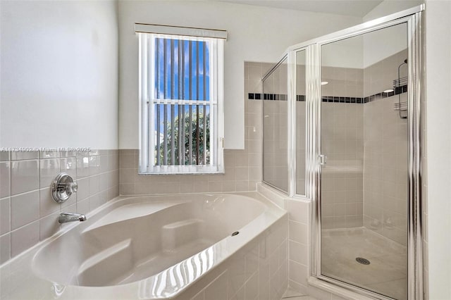 bathroom featuring plus walk in shower