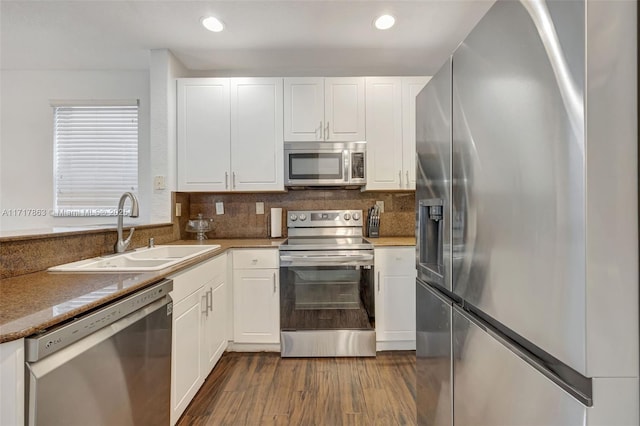 kitchen with white cabinetry, sink, and stainless steel appliances