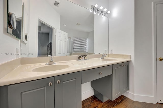 bathroom featuring vanity and hardwood / wood-style floors