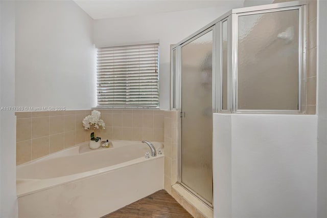 bathroom with hardwood / wood-style floors and plus walk in shower