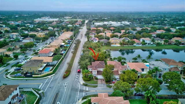 birds eye view of property featuring a water view