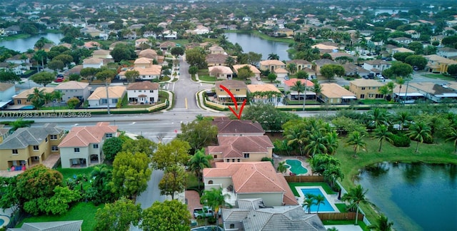 drone / aerial view with a water view