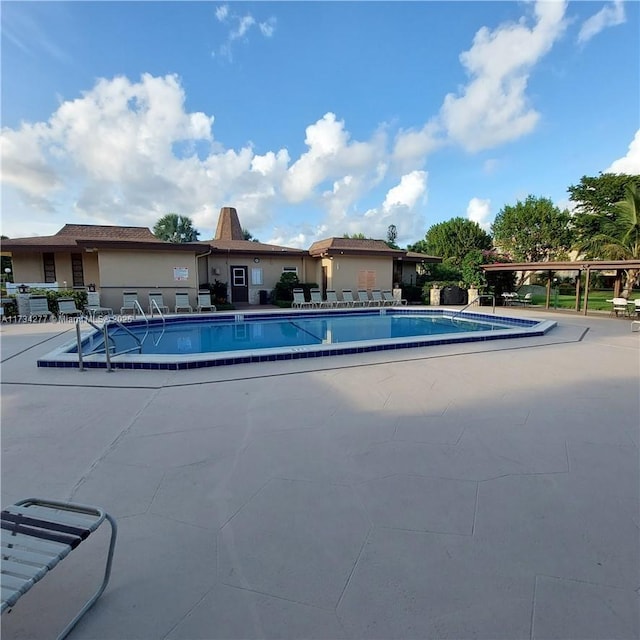 view of pool featuring a patio