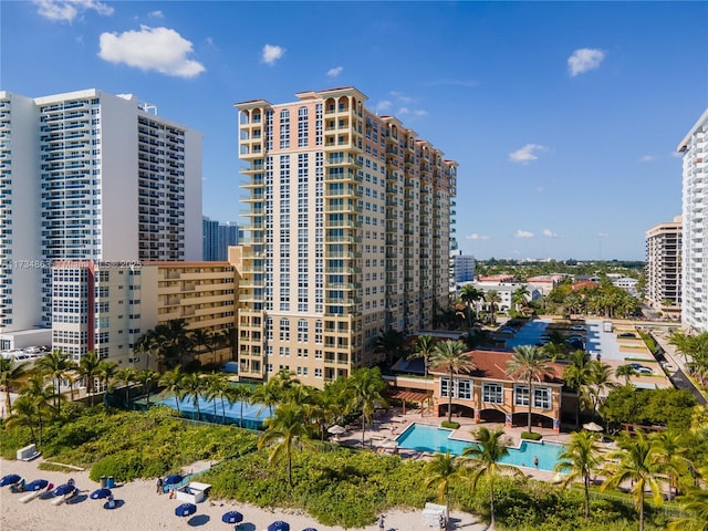 view of building exterior with a community pool