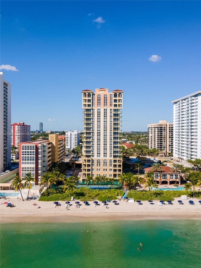 bird's eye view featuring a beach view and a water view