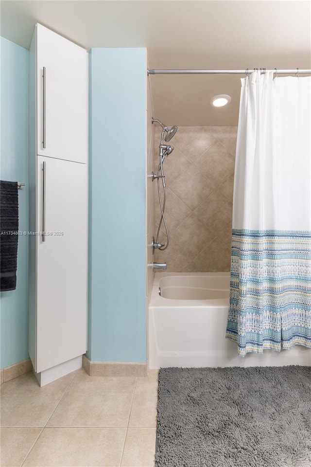 bathroom featuring shower / tub combo with curtain and tile patterned flooring