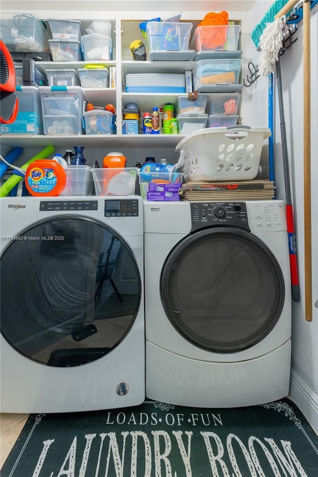 washroom featuring washer and clothes dryer