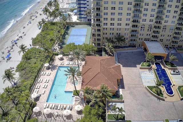 birds eye view of property with a view of the beach and a water view