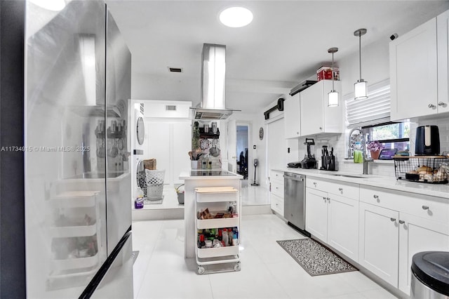 kitchen with pendant lighting, island range hood, tasteful backsplash, white cabinetry, and stainless steel appliances