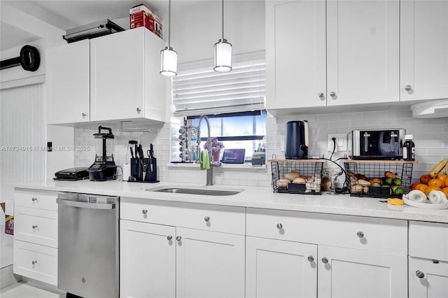 kitchen with white cabinetry, dishwasher, sink, and pendant lighting