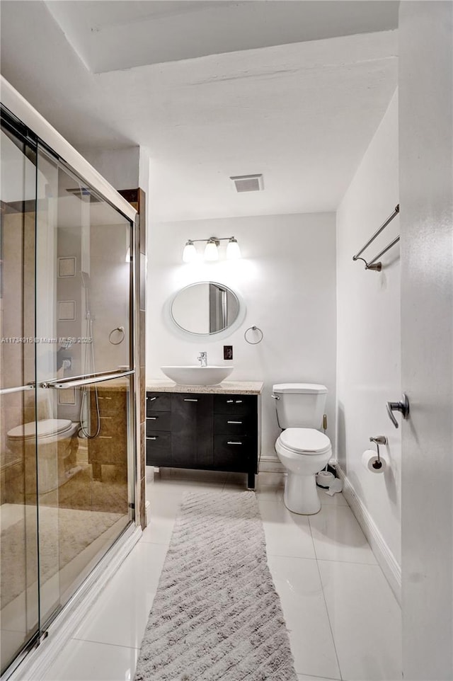 bathroom with walk in shower, vanity, toilet, and tile patterned flooring