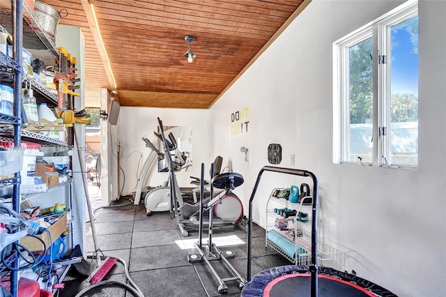 workout room featuring lofted ceiling and wooden ceiling