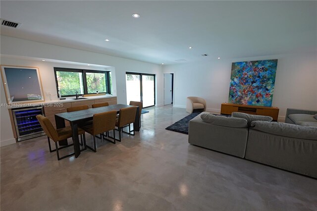 living room featuring concrete flooring