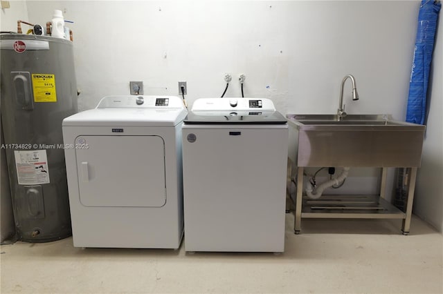 washroom with sink, washer and clothes dryer, and water heater