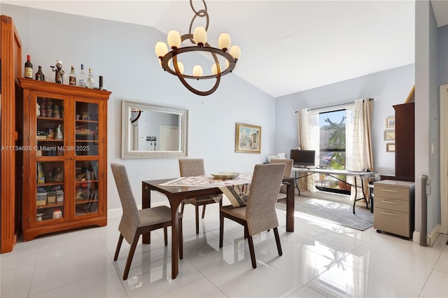 tiled dining room with an inviting chandelier and vaulted ceiling